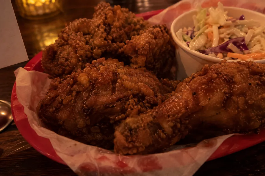 Fried chicken in dim bar light