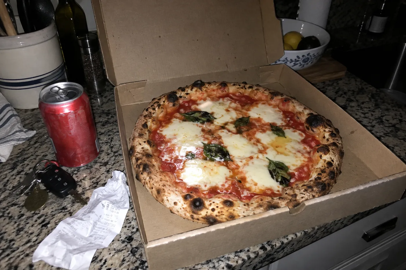 Pizza photographed at night with the phone flash