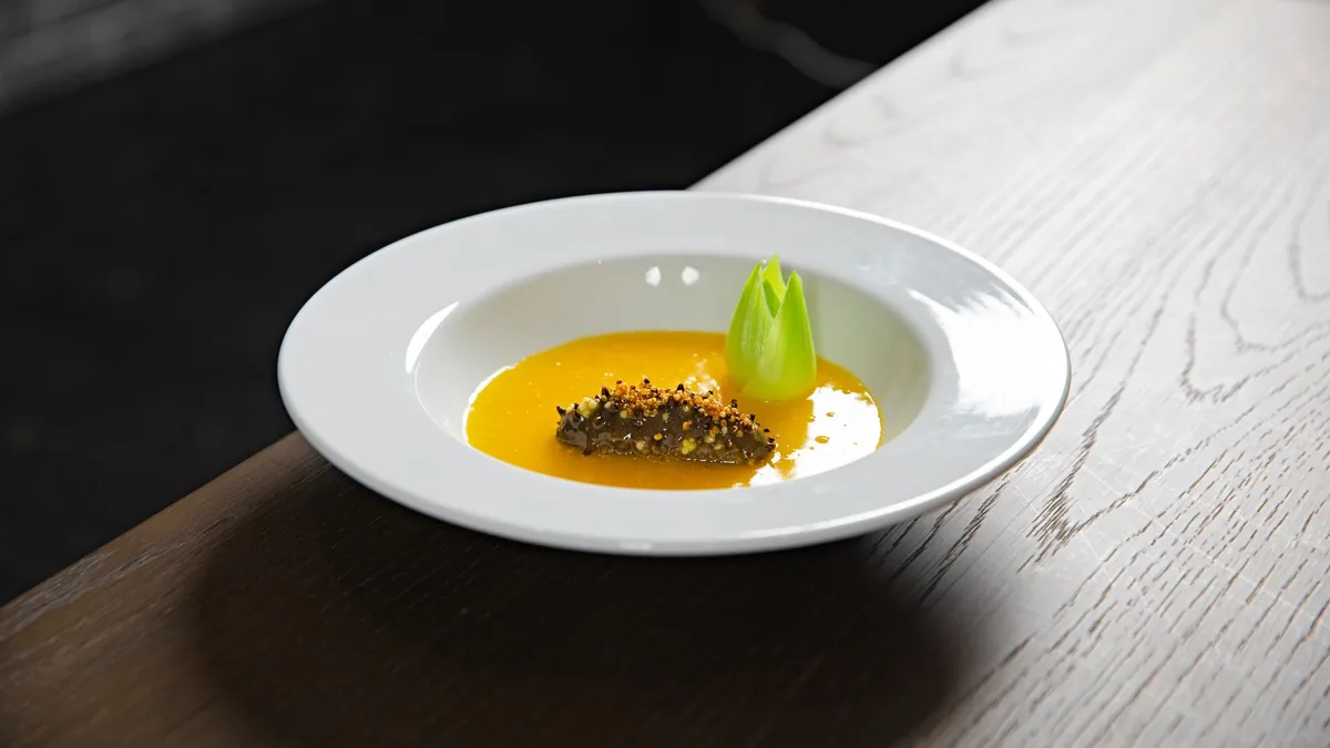 A polished, menu-ready plated dish on a clean surface with soft studio-style light, the kind of result an AI food image generator produces from a phone photo.